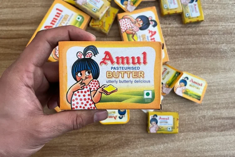 Amul butter genuine pack held in hand 2026 real Indian stock